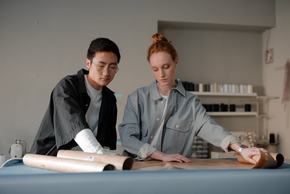 Asian man and Caucasian woman working together